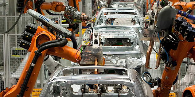 Cars during production by robots on the assembly line