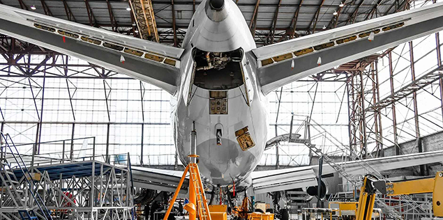 An airplane is being worked on in a workshop