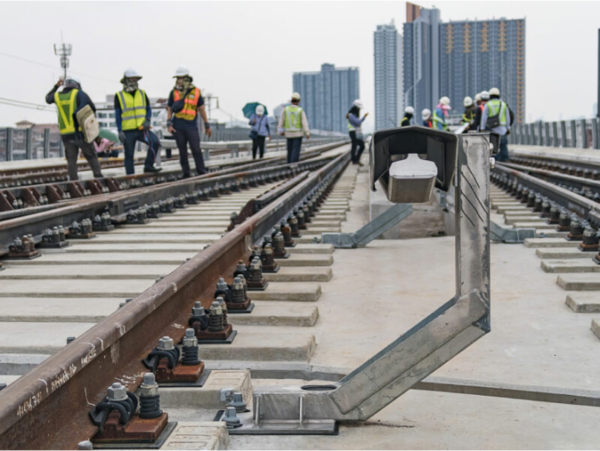 Men looking at a rail system